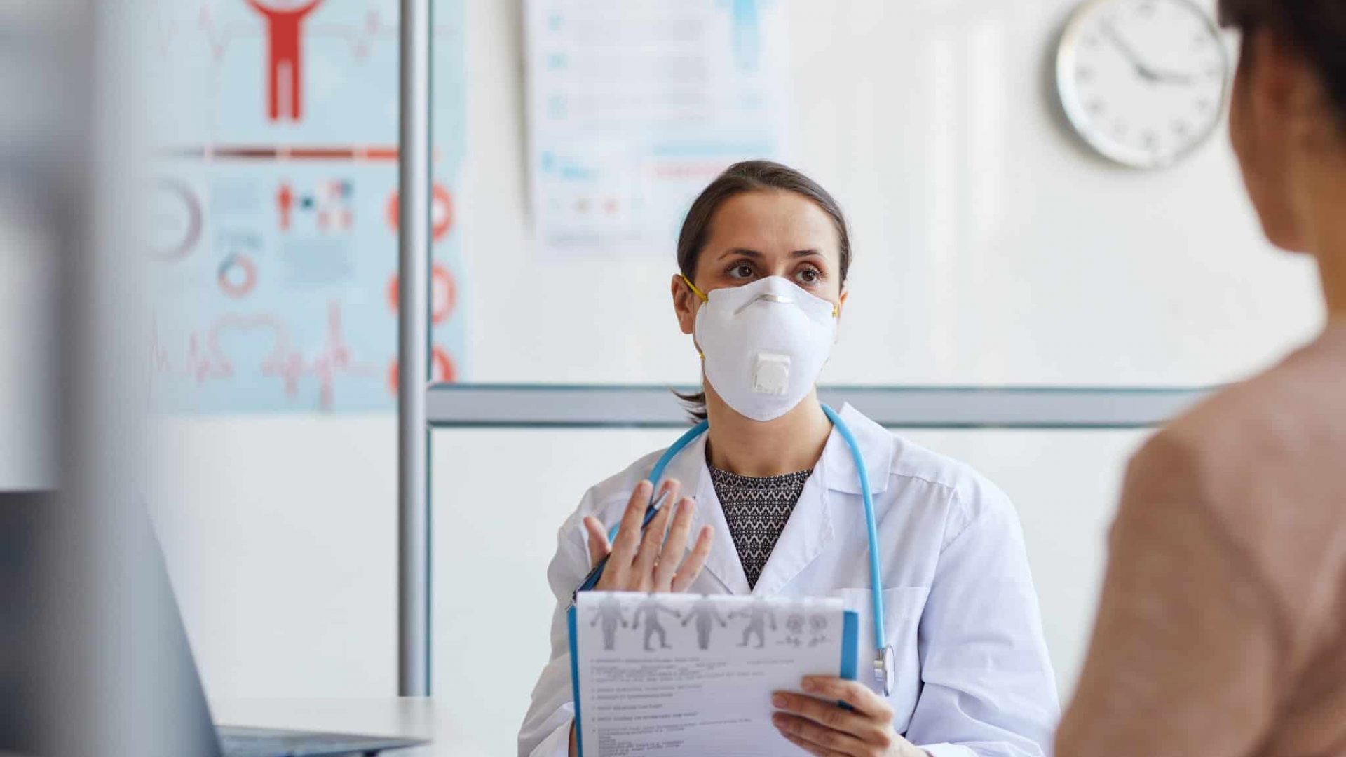 doctor-explaining-the-signs-of-illness-2021-08-27-19-10-13-utc-2048x1365