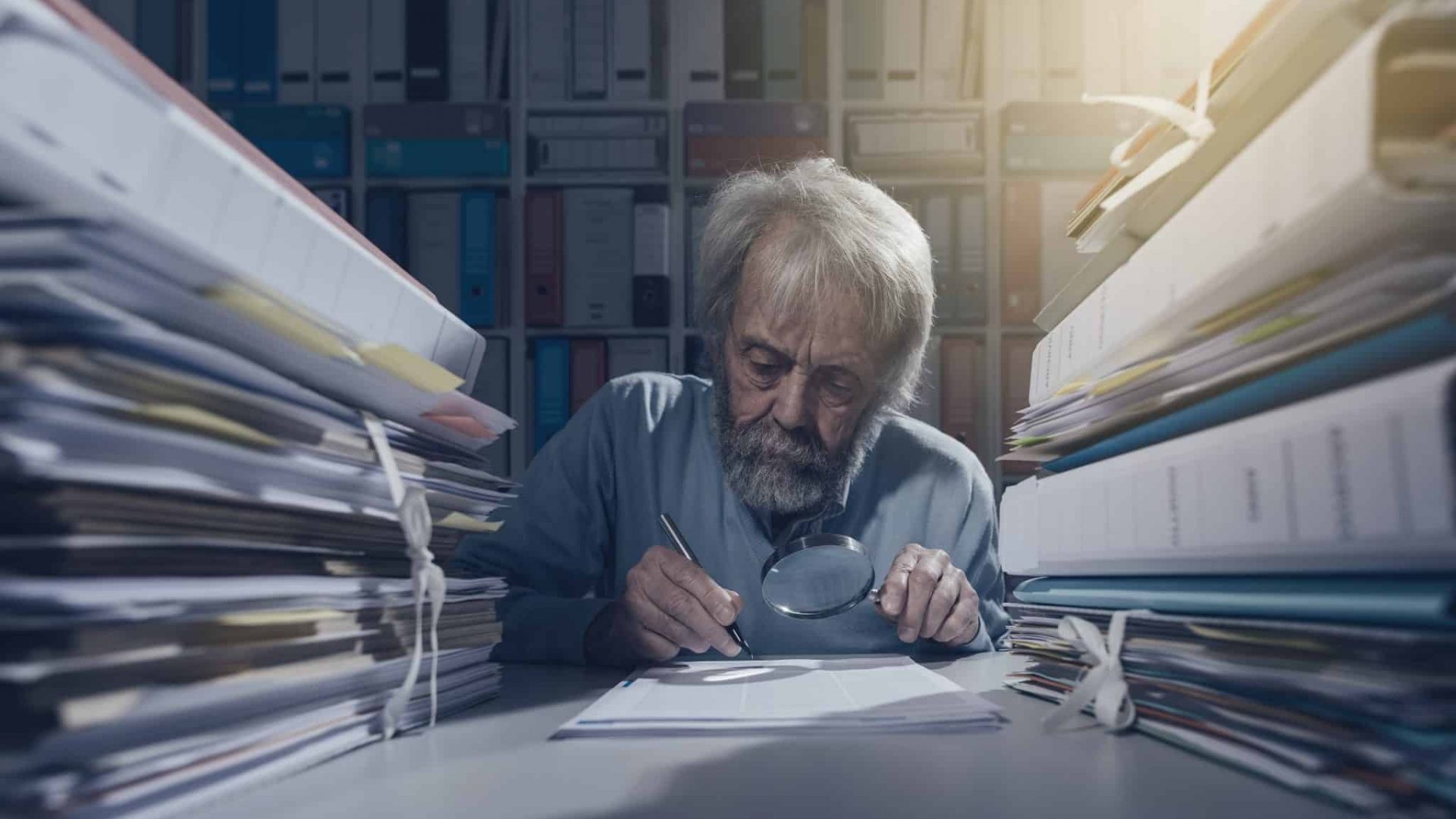 senior-researcher-using-a-magnifier-2021-08-26-22-39-51-utc-2048x1186